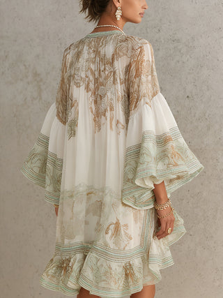Solange | Robe courte asymétrique en mousseline verte à volants et manches cloches